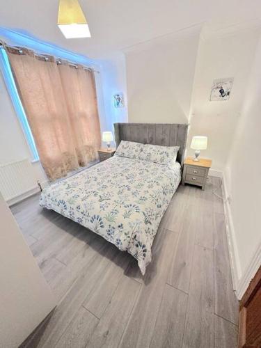 a small bedroom with a bed and a window at Entire 3bedroom home can sleep 5 in Gillingham