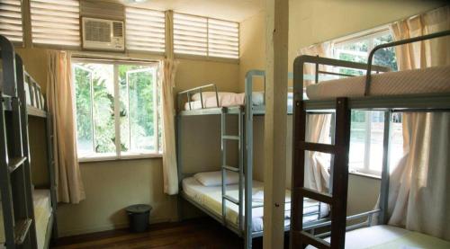 Ένα ή περισσότερα κρεβάτια σε δωμάτιο στο OYO 90980 Rainbow Island Sepanggar