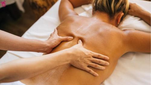a woman getting a massage at a spa at Vadgalamb Apartman & Jacuzzi in Miskolctapolca