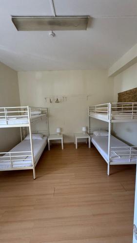 Postel nebo postele na pokoji v ubytování Garden Hostel