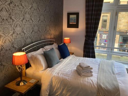 Ένα ή περισσότερα κρεβάτια σε δωμάτιο στο The Art Flat Glasgow