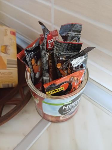 a bucket full of snacks sitting on a table at Vranje City Center, Penthouse Delux Apartment in Vranje