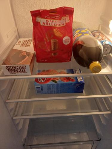 a refrigerator filled with food andadobeadobeadobeadobeadobeadobebestosbestosbestosbestos at Vranje City Center, Penthouse Delux Apartment in Vranje