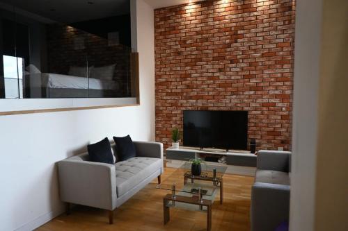 Μια τηλεόραση ή/και κέντρο ψυχαγωγίας στο Stunning City Centre Duplex