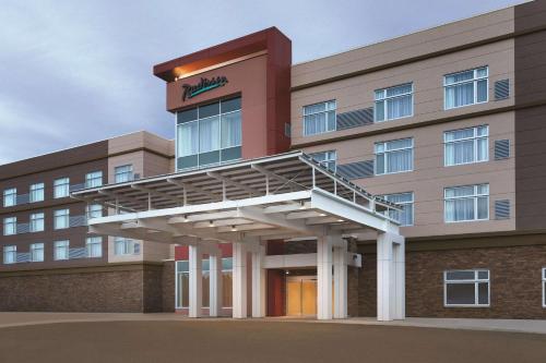 a hospital building with a staircase in front of it at Radisson Kingswood Hotel & Suites, Fredericton in Fredericton