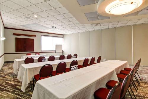 a conference room with tables and chairs and a podium at Radisson Hotel & Conference Centre Edmonton in Edmonton