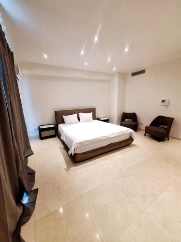 Letto o letti in una camera di Aphrodite Plaza