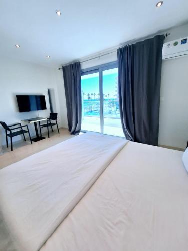 Letto o letti in una camera di Aphrodite Plaza