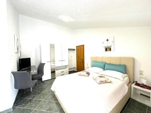 Кровать или кровати в номере NellaToni Apartments
