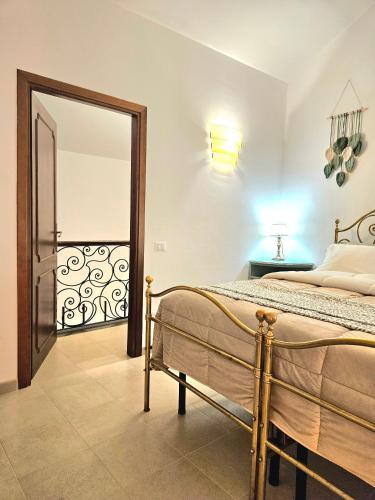 a bedroom with a bed and a large mirror at Casa Estia a Due Passi dal Duomo in Orvieto