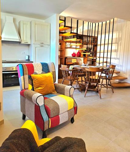 a living room with a couch and a dining room at Casa Estia a Due Passi dal Duomo in Orvieto