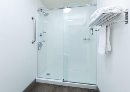 a shower with a glass door in a bathroom at Holiday Inn Express Spokane-Valley by IHG in Spokane Valley