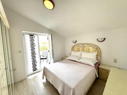 Кровать или кровати в номере NellaToni Apartments