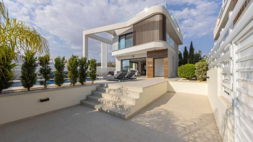 an image of a house with a balcony at Nissi Residences Villa 4 in Ayia Napa