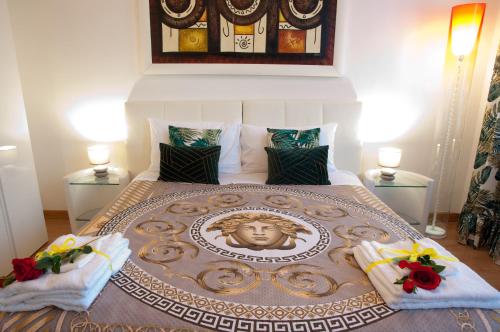 a bedroom with a large bed with a face on it at Arena d'Intorno in Verona