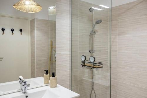 a bathroom with a shower and a sink at Le Bohème Classé 3 étoiles in La Londe-les-Maures