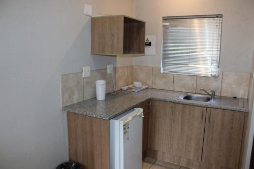 Kuchyň nebo kuchyňský kout v ubytování Clarion Guest House