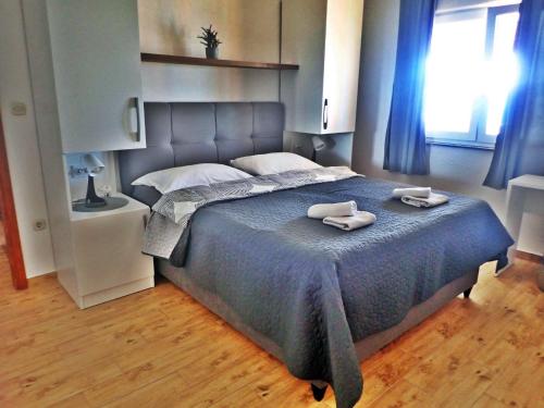 Postel nebo postele na pokoji v ubytování Apartments Bili