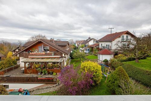 a house with a swimming pool in a residential neighborhood at Ferienwohnung Lueg Ins Wiesental in Steinen