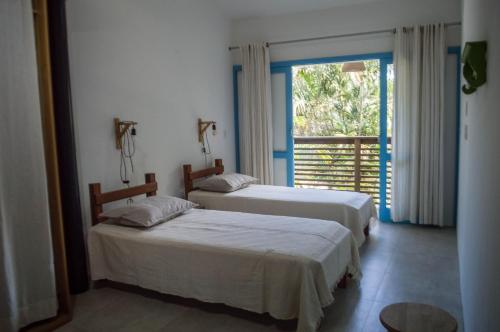 Postel nebo postele na pokoji v ubytování Corais da Barra. Tranquilidade a 400 metros da beira da Praia da Barra