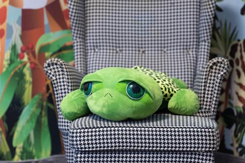 a stuffed frog is sitting on a chair at Mercure Karpacz Skalny in Karpacz