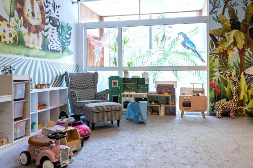 a room with many toys in it with a large window at Mercure Karpacz Skalny in Karpacz