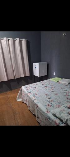 Inn R1 Pousada e Passeiosにあるベッド
