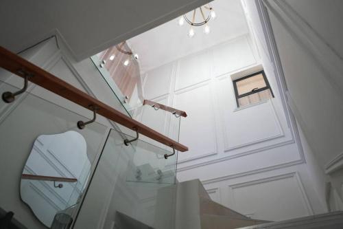 a room with a glass table and a window at Modern Penthouse in Roodepoort