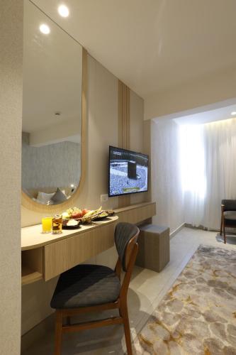 TV a/nebo společenská místnost v ubytování G Hotel Amman