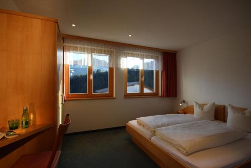 Кровать или кровати в номере dr'Berghof