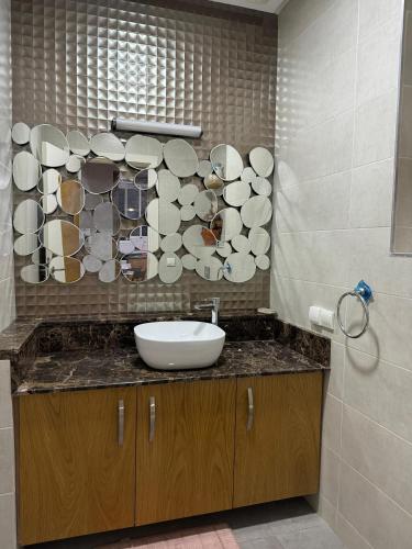 a bathroom with a sink and a mirror at emiwadar Agadir Lunja Village in Agadir