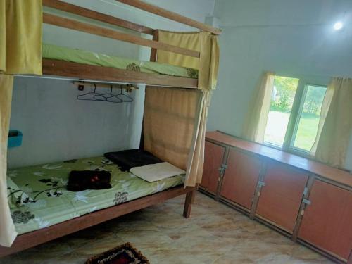 Postel nebo postele na pokoji v ubytování Mukda