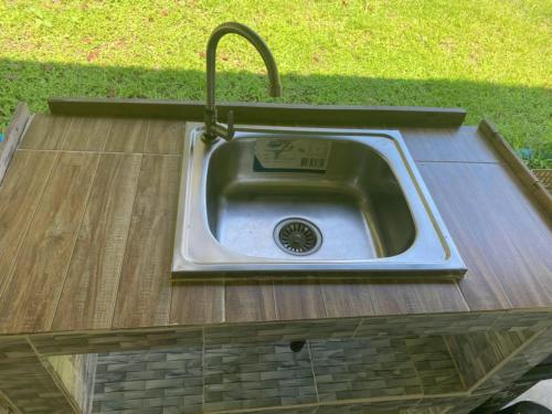 a stainless steel sink in a wooden counter top at Mukda in Ko Yao Noi