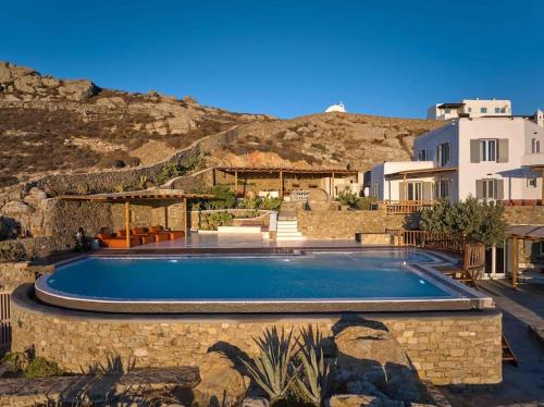 a swimming pool in front of a house at Villa Maera 3 in Kalo Livadi