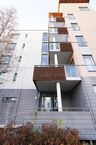 an external view of a tall building with stairs at Romantic Sauna Retreat Near Sello and Nature Perfect in Espoo