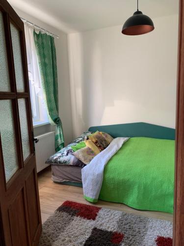 Postel nebo postele na pokoji v ubytování Mníchov dvor
