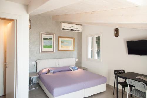 Tempat tidur dalam kamar di Il Nettare