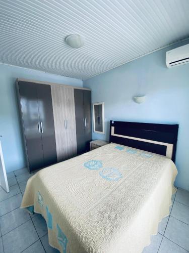 En eller flere senge i et værelse på Casa de Férias