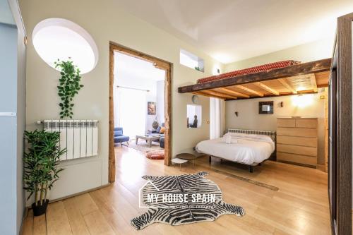 A bed or beds in a room at MyHouseSpain - Nuevo loft en Malasaña