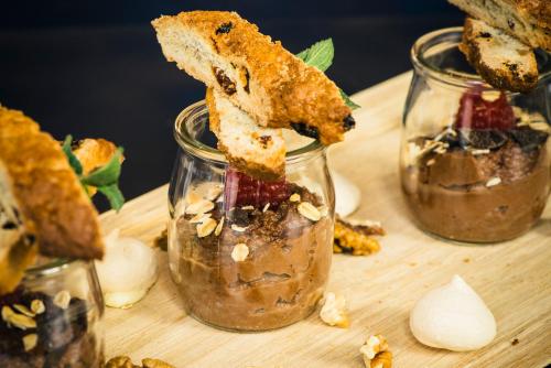 a piece of bread being lifted from a jar of food at Vienna House by Wyndham Andel's Lodz in Łódź