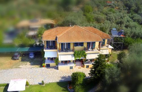 an aerial view of a house with an orange roof at Alexia Studios in Nydri