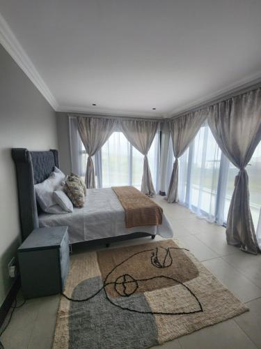 Ένα ή περισσότερα κρεβάτια σε δωμάτιο στο Zululami dinning