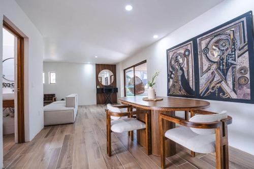 a dining room with a table and chairs at Bungalow Cajititlan 2 bedrooms & lake view in Cajititlán