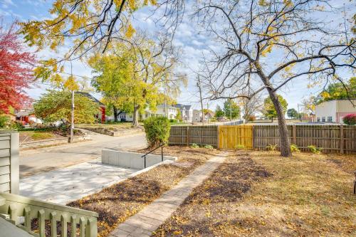 a yard with a fence and a tree at Family-Friendly Independence Home 5 Mi to Stadium in Independence