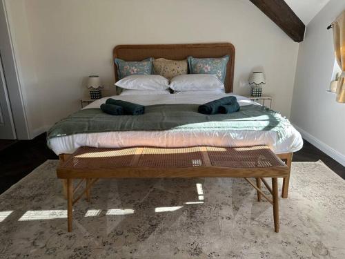 a bed with two pillows on it in a bedroom at Stylish Two Bedroom Family Villa in Sopot