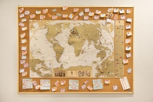 a map of the world with magnets on it at Bianca Elegance Rooms in La Spezia