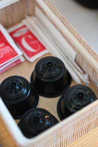 three black olives in a white plastic drawer at Bianca Elegance Rooms in La Spezia