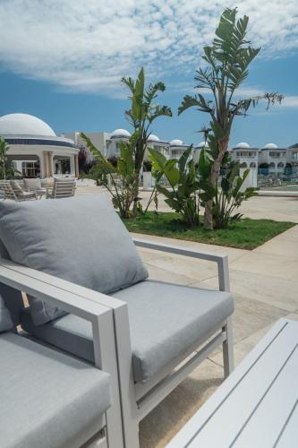 a bench on the roof of a building at Royal Tulip Taj Sultan in Hammamet