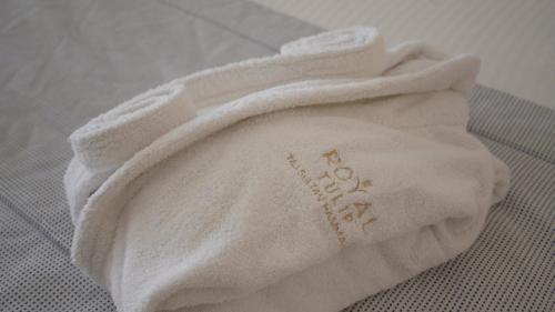 a towel that is sitting on a table at Royal Tulip Taj Sultan in Hammamet