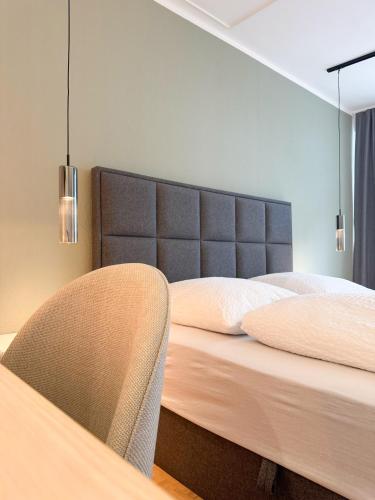 Postel nebo postele na pokoji v ubytování Moderne City-Wohnung mit Self Check-In und Free Wifi im Zentrum
